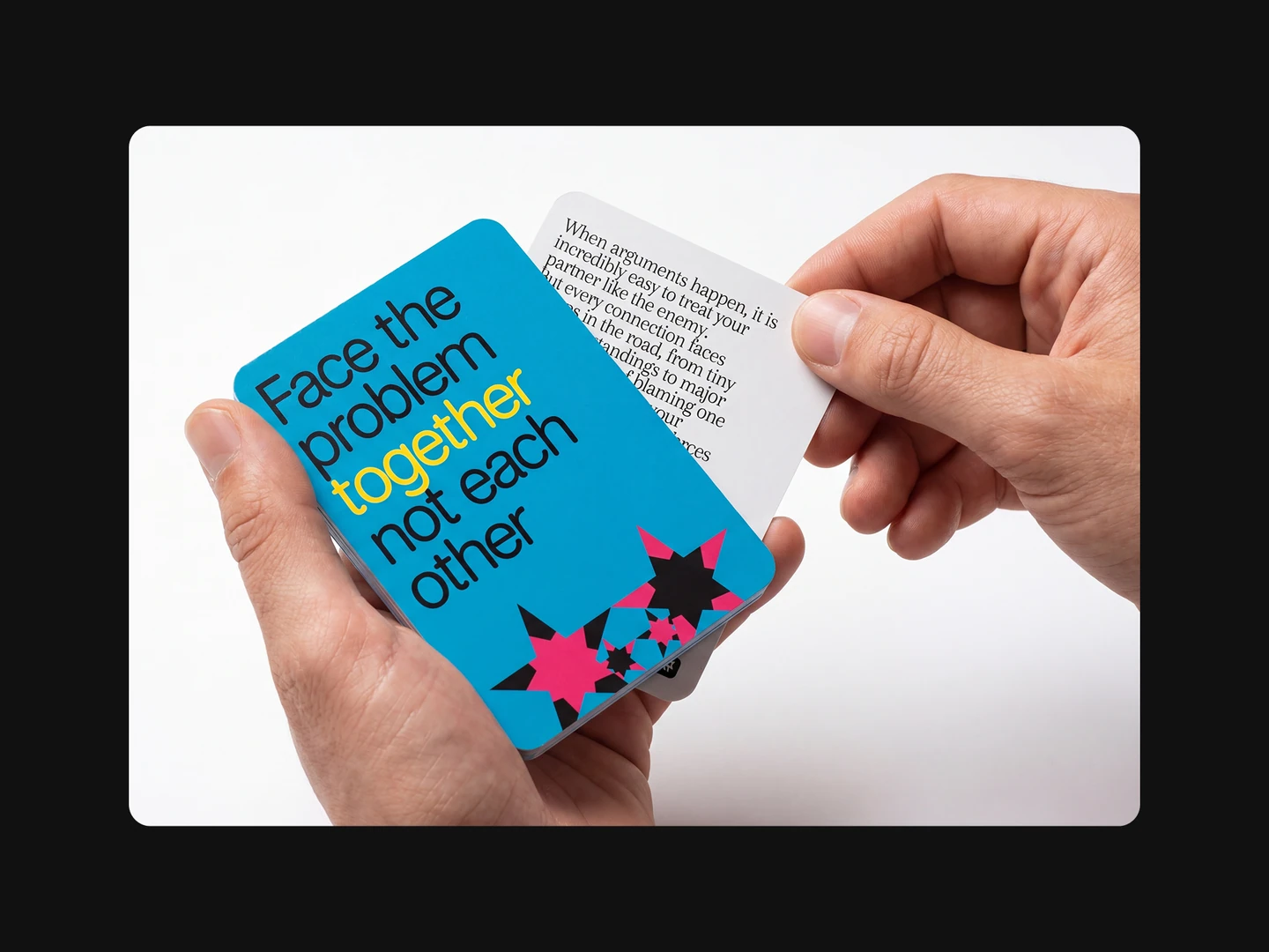 AI-generated mockup of 7words playing cards held in two hands